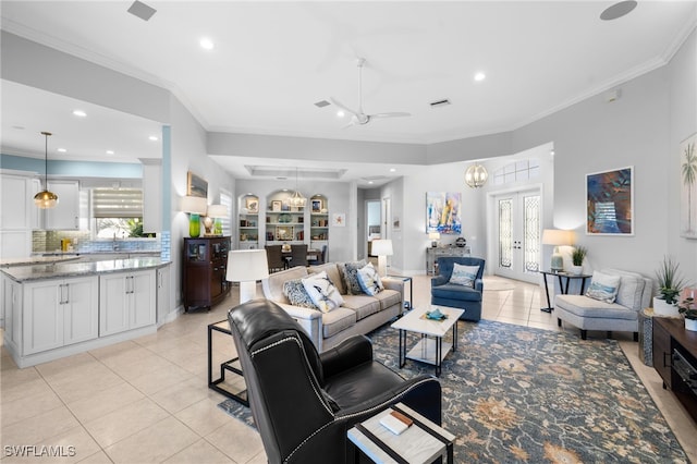 tiled living room featuring french doors, ceiling fan, and crown molding