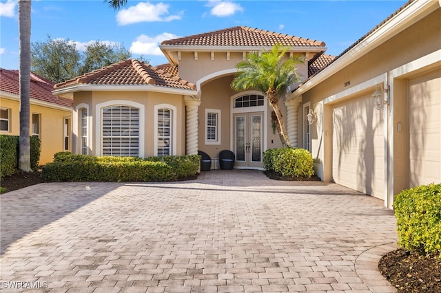 property entrance with french doors and a garage