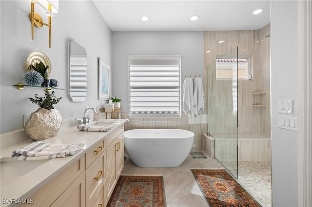 bathroom featuring tile patterned floors, separate shower and tub, and vanity