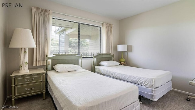 bedroom with dark colored carpet