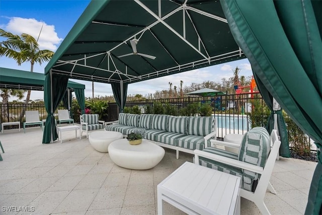 view of patio featuring a gazebo and an outdoor hangout area