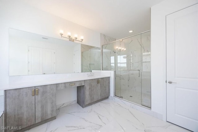 bathroom featuring vanity and an enclosed shower