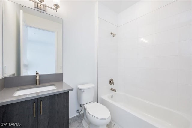 full bathroom featuring vanity, tiled shower / bath combo, and toilet