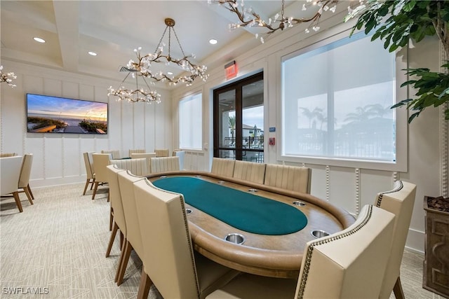 dining space featuring a healthy amount of sunlight and beamed ceiling