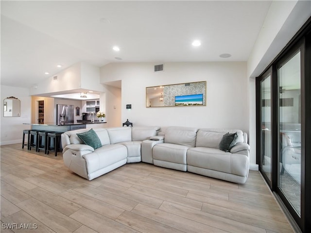 living room with vaulted ceiling