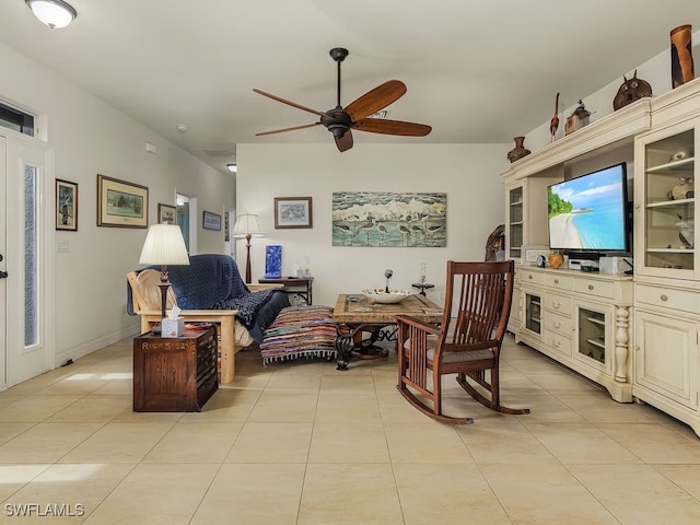 sitting room featuring light tile patterned floors and ceiling fan