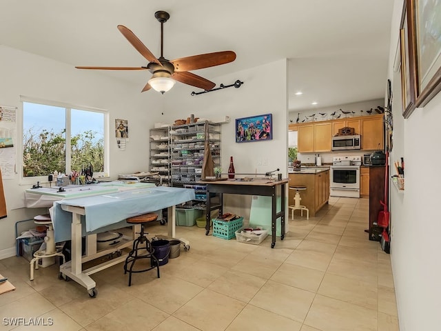 tiled dining room with ceiling fan