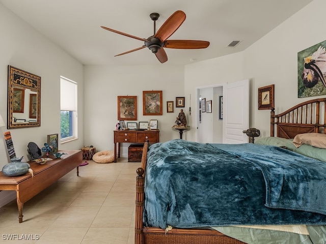 tiled bedroom featuring ceiling fan