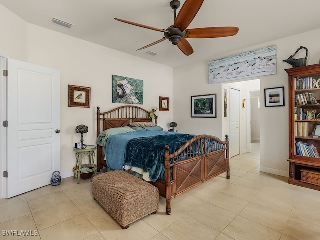 tiled bedroom featuring ceiling fan