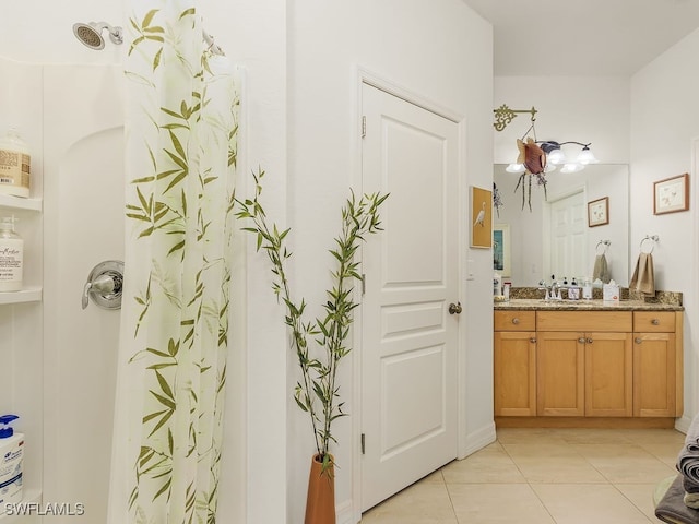 bathroom with tile patterned flooring, vanity, and a shower with shower curtain