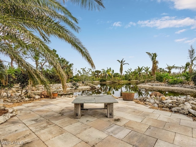 view of patio / terrace with a water view