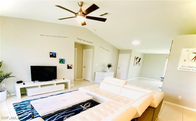 tiled living room featuring ceiling fan and lofted ceiling