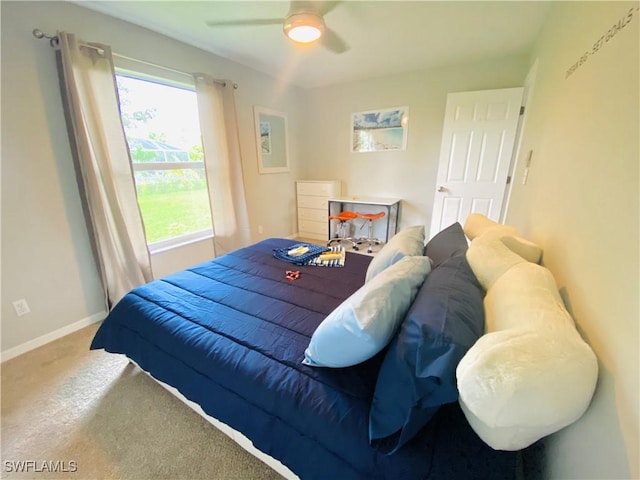 bedroom with ceiling fan and carpet floors