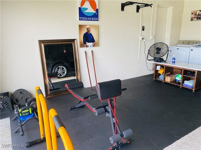 exercise area with washer and clothes dryer