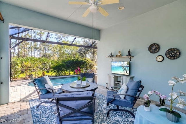 sunroom / solarium featuring ceiling fan and a pool