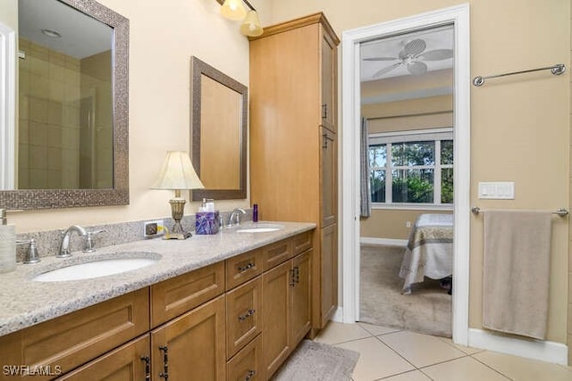 bathroom featuring tile patterned floors, ceiling fan, and vanity