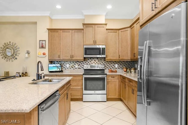 kitchen with backsplash, crown molding, sink, and stainless steel appliances