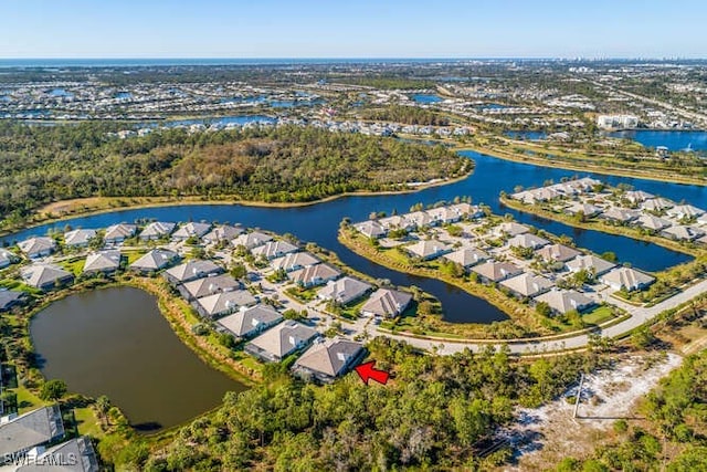 drone / aerial view with a water view