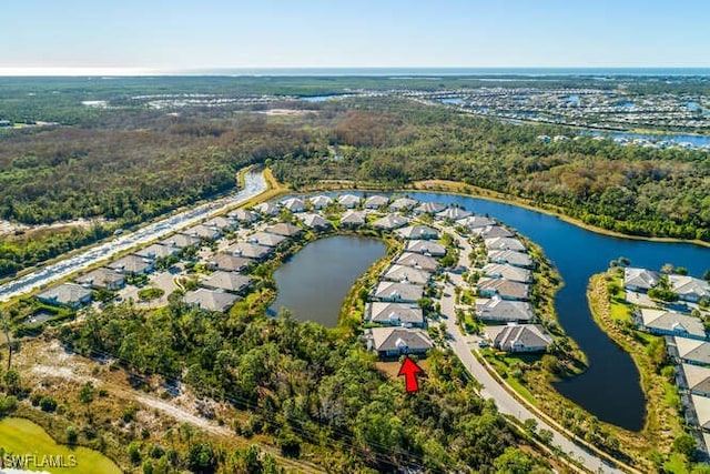 drone / aerial view with a water view