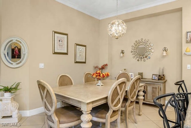 tiled dining room featuring ornamental molding and a chandelier