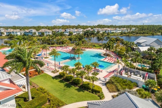 birds eye view of property with a water view