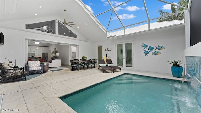 back of house with glass enclosure, french doors, pool water feature, ceiling fan, and a patio area