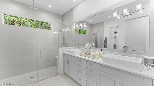 bathroom featuring tile patterned floors, vanity, and walk in shower