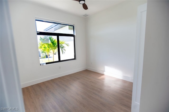 empty room featuring ceiling fan and light wood-type flooring