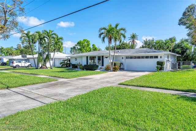 single story home featuring a front yard and a garage