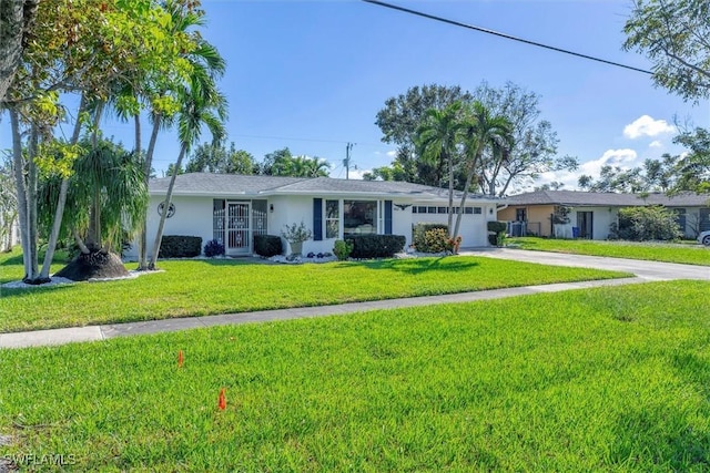 ranch-style house featuring a garage and a front yard