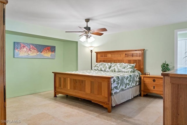 tiled bedroom with ceiling fan