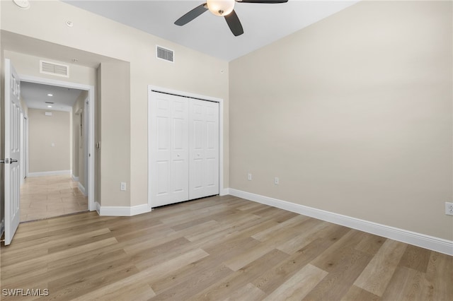 unfurnished bedroom with a closet, ceiling fan, and light hardwood / wood-style flooring