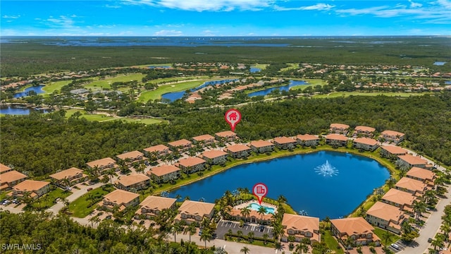 birds eye view of property with a water view