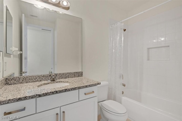 full bathroom with shower / bath combination with curtain, toilet, and vanity