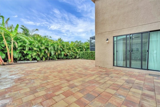 view of patio / terrace with glass enclosure