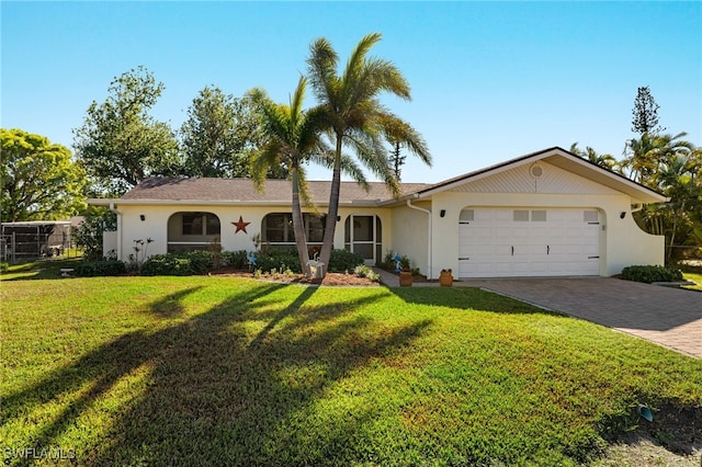 ranch-style home featuring a front lawn and a garage