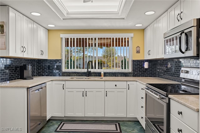 kitchen with white cabinetry, sink, and appliances with stainless steel finishes