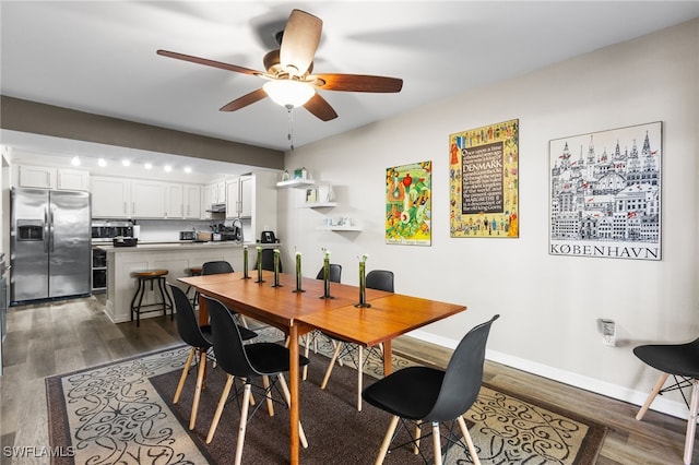 dining area featuring ceiling fan and dark wood-type flooring