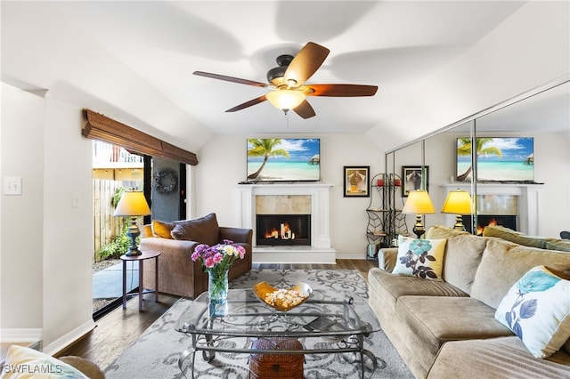 living room featuring ceiling fan, dark hardwood / wood-style flooring, and lofted ceiling