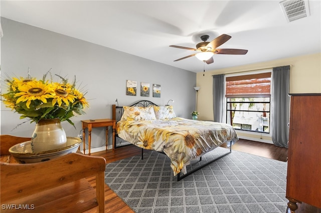 bedroom featuring hardwood / wood-style floors and ceiling fan