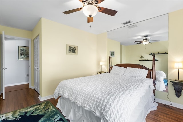 bedroom featuring dark hardwood / wood-style floors and ceiling fan