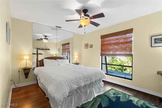 bedroom with ceiling fan and dark hardwood / wood-style floors