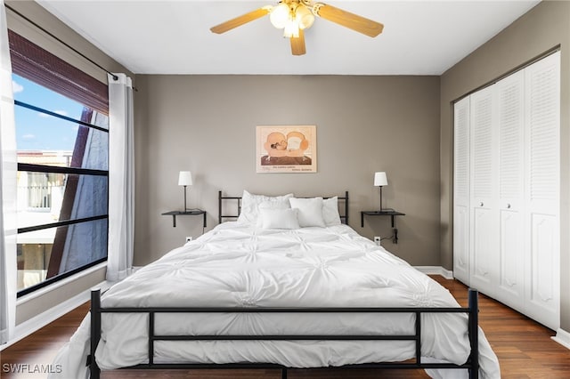 bedroom featuring dark hardwood / wood-style flooring, a closet, and ceiling fan