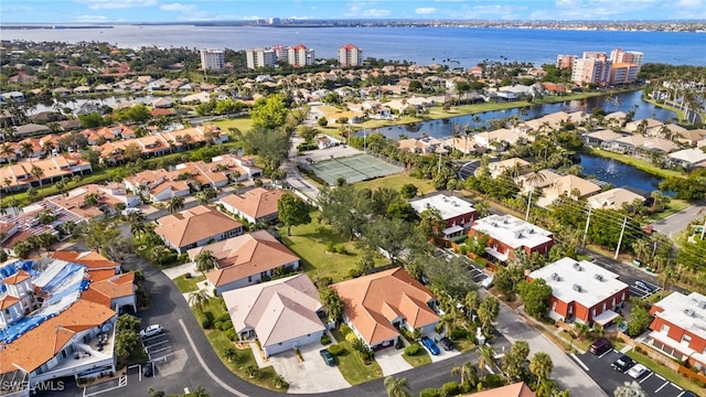 birds eye view of property with a water view