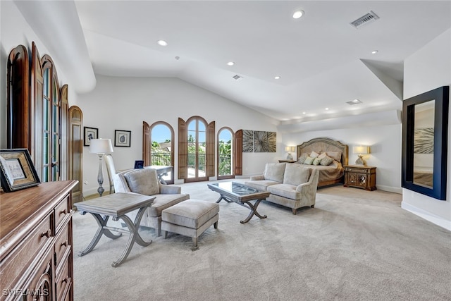 carpeted bedroom with french doors and vaulted ceiling