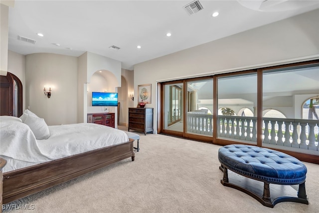 bedroom with access to exterior and carpet