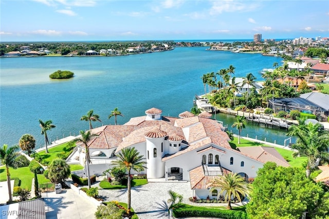 birds eye view of property with a water view