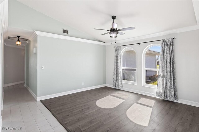 unfurnished room with ceiling fan, ornamental molding, vaulted ceiling, and hardwood / wood-style floors