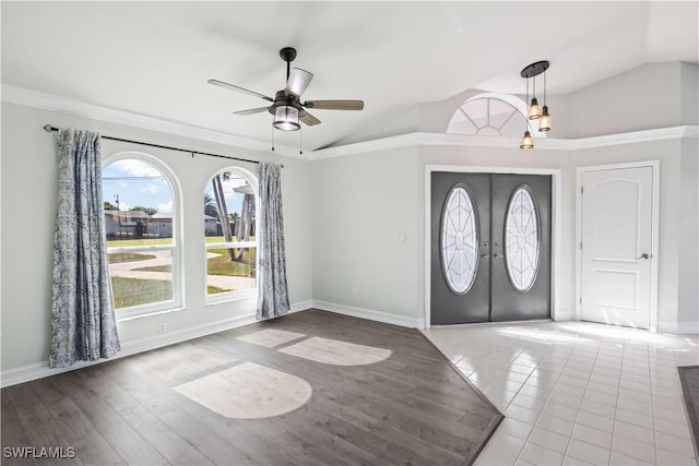 foyer with french doors, ceiling fan, vaulted ceiling, and hardwood / wood-style floors