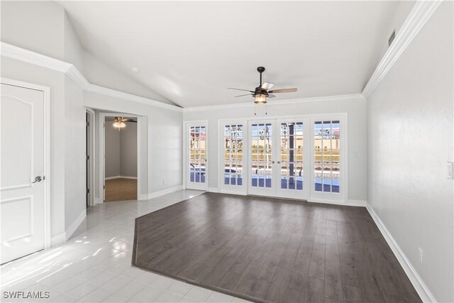 unfurnished room featuring crown molding, lofted ceiling, light wood-type flooring, and ceiling fan